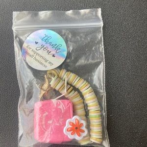 Gold charm with candy and one sticker